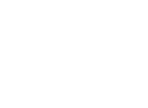 A man is riding a bike off the road.