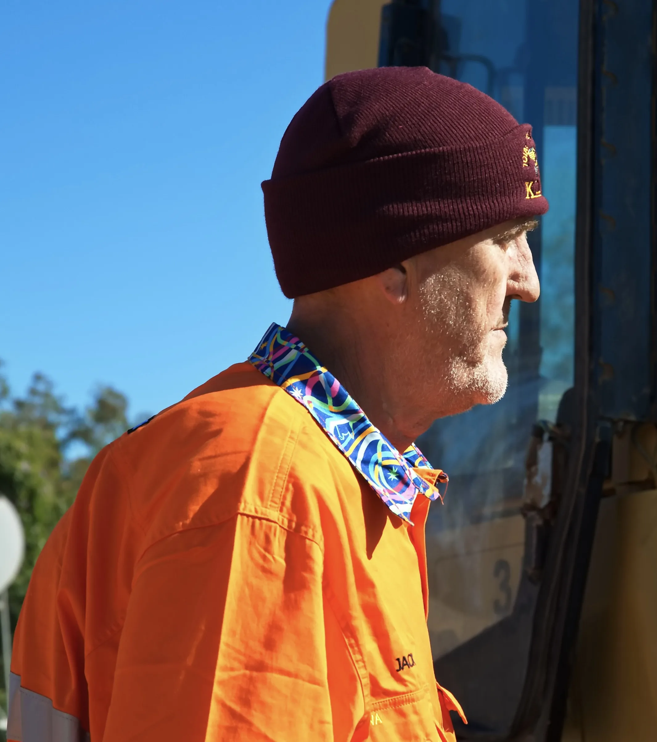 A man wearing a beanie off the road.
